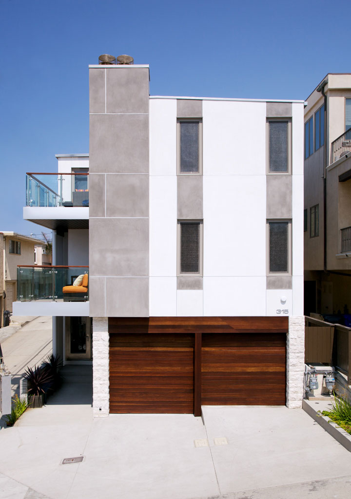 The front façade from 24th Street with the new Ipe garage doors