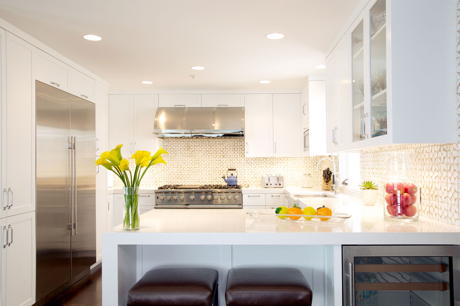 The new kitchen: white cabinets and Ann Sacks tile backsplash