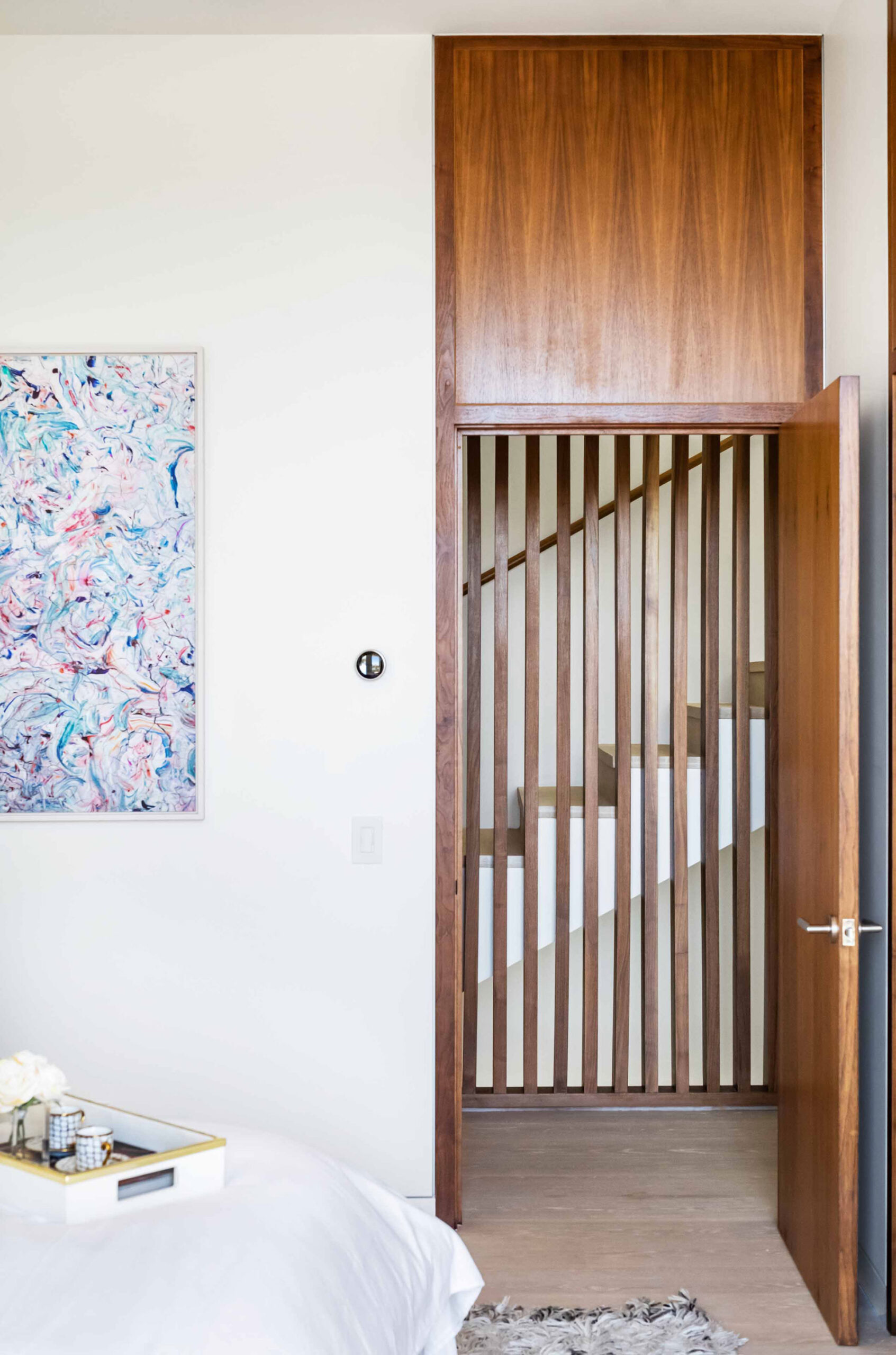 Looking through a bedroom door through the walnut screen to the stair to the roof deck. Photo: © Anthony Barcelo, Barcelo Photography