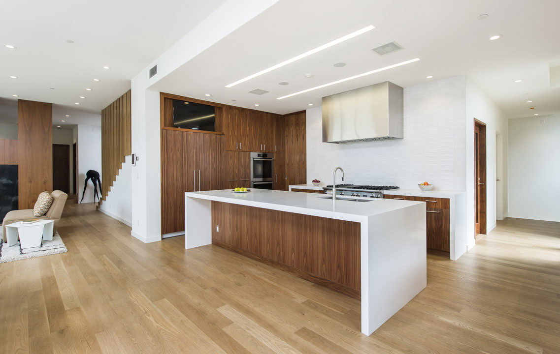 A view of the kitchen with backsplash by Heath Ceramics.