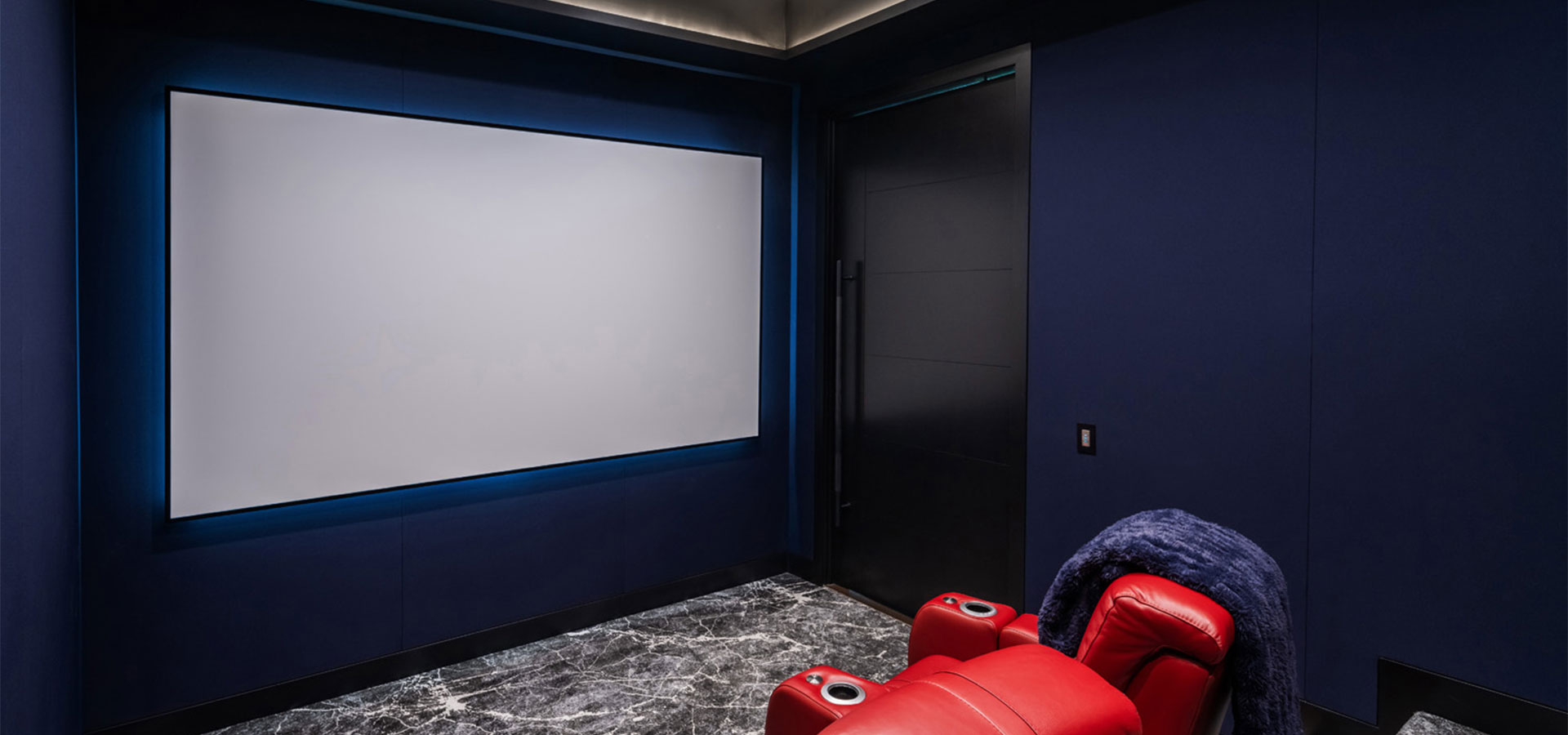 The media room features LED lighting, acoustical materials and concealed speakers