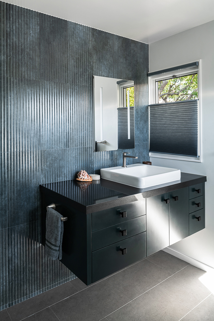 The principal bath vanity with blue green pleated tile. Photo: Photo: ©Paul Vu, Here and Now Agency
