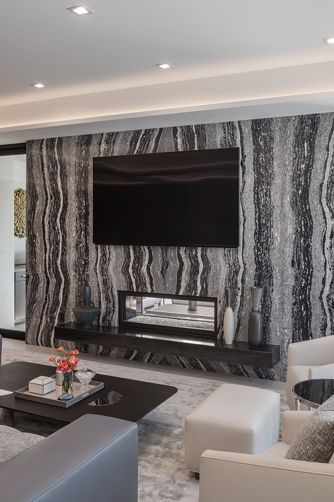 The fireplace is visible from both the living room and the California Room. Photo: ©Paul Vu, Here and Now Agency