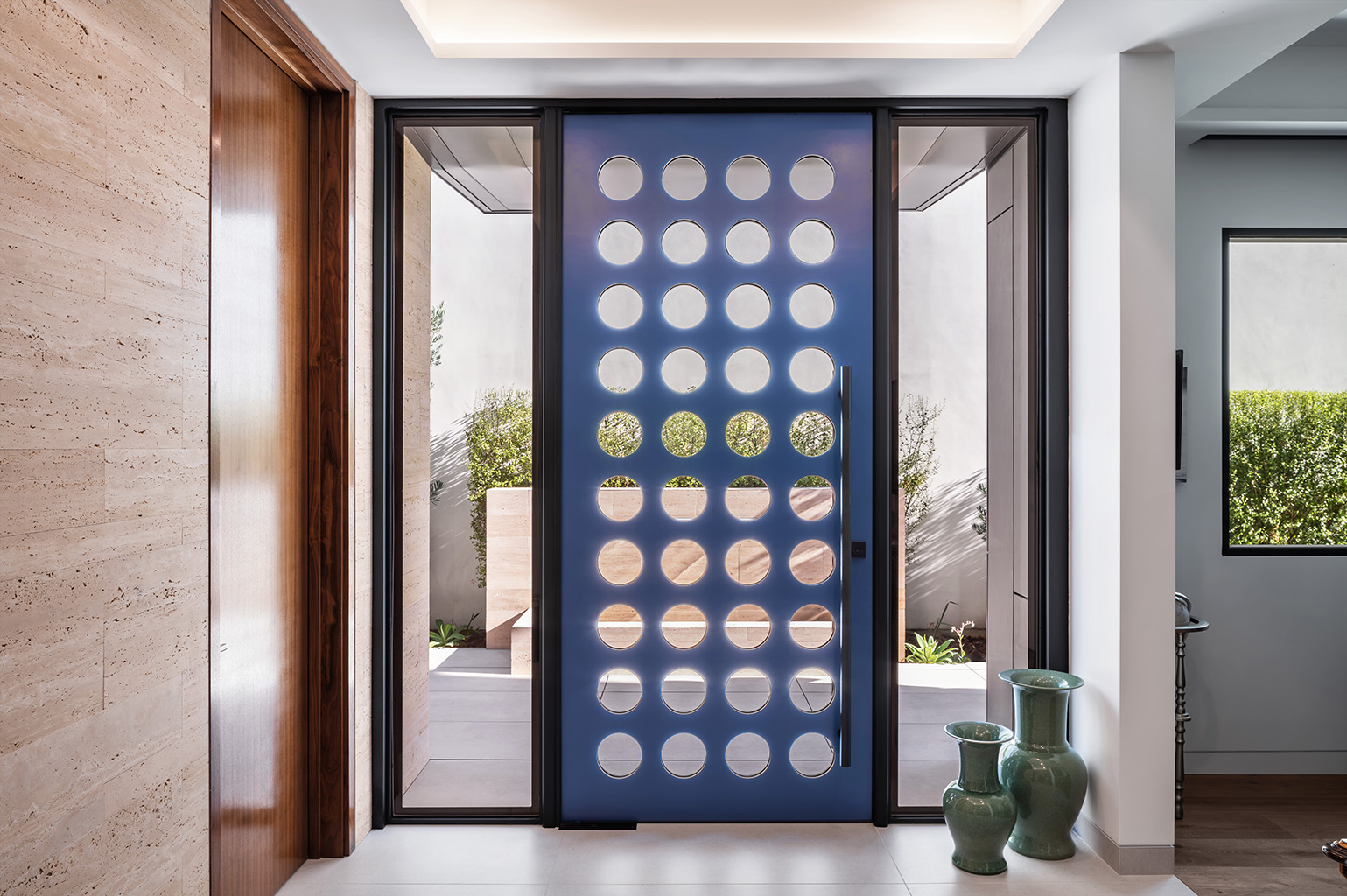 Looking through the front door to the fountain, the Study is adjacent to the front door. Photo: ©Paul Vu, Here and Now Agency